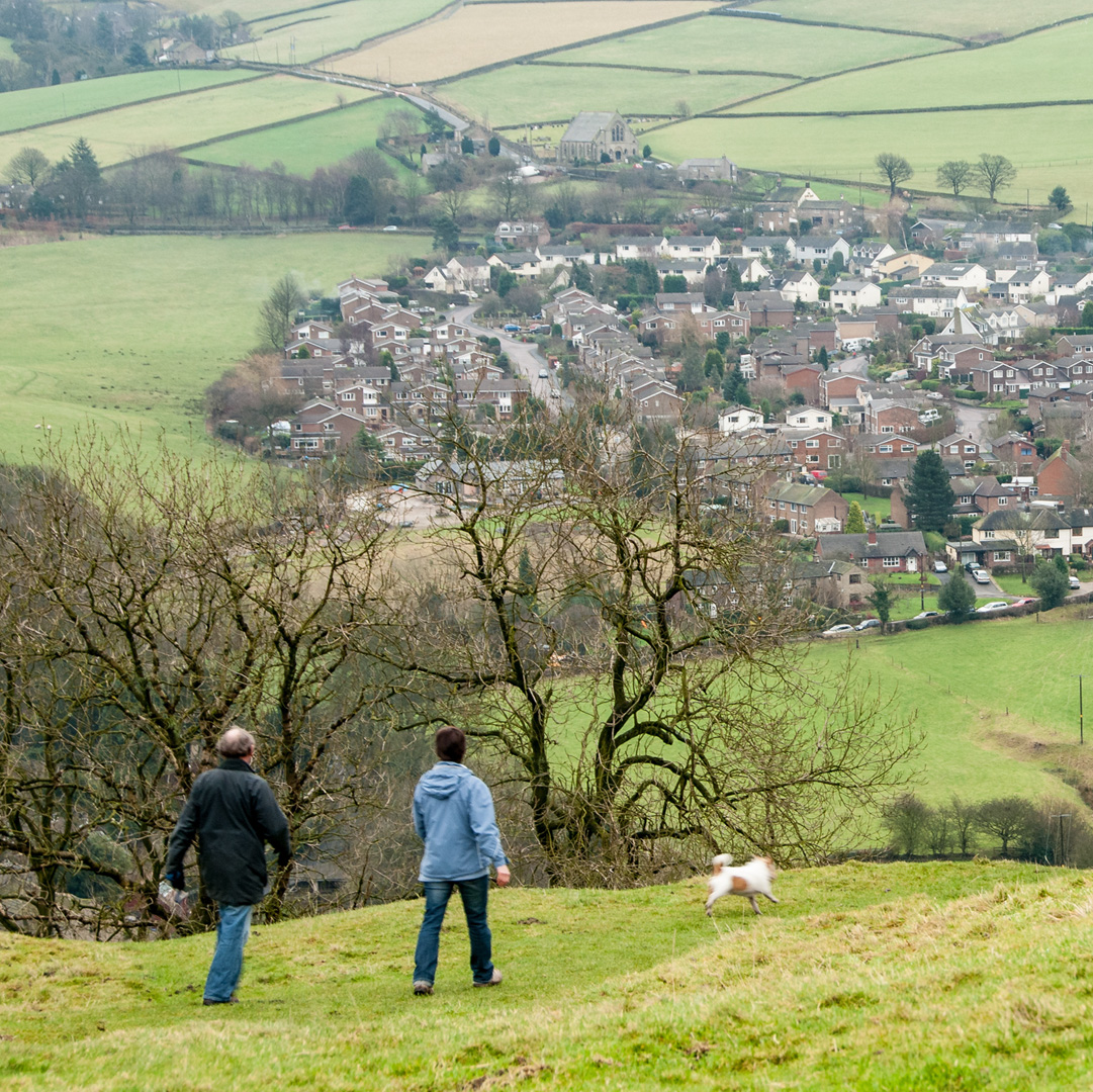 Photograph showing two people walking in the countryside